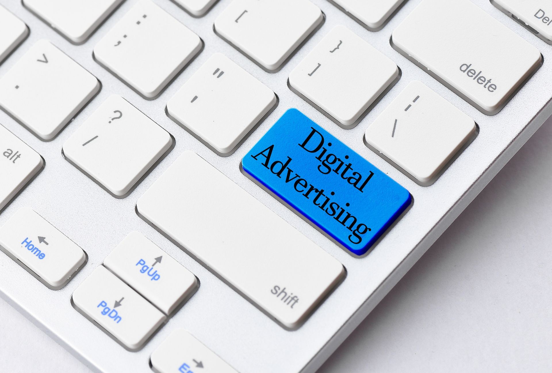Business concept: Digital Advertising on computer keyboard background